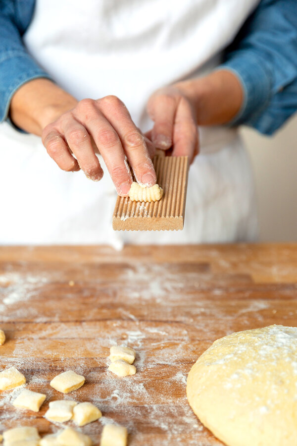 Roll the dough over a grooved board